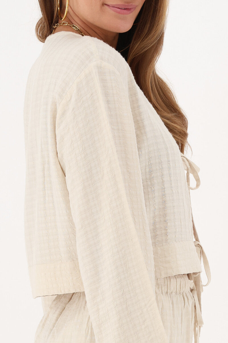 Top en jacquard beige avec détails en forme de nœud