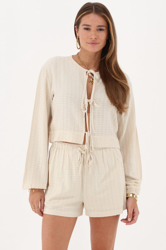 Top en jacquard beige avec détails en forme de nœud